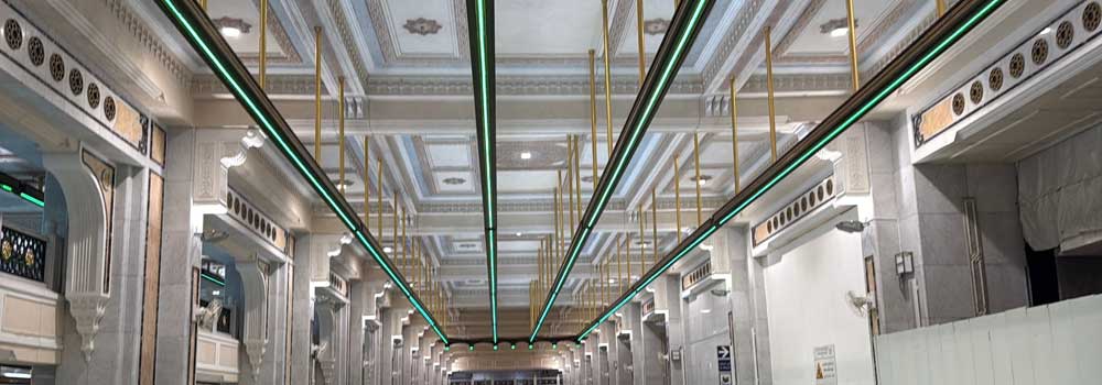 Green fluorescent lights in the Sai corridor of Masjid al-Haram marking the Ramal zone for men during Umrah